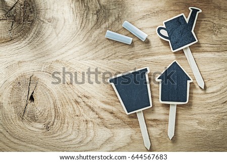 Set of black wooden chalkboard price sign tags on wood board gardening concept.
