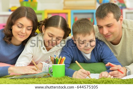 Children draw with their parents