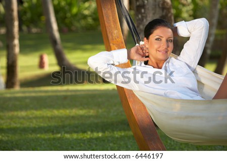 20-25 years woman portrait relaxing on hammock at exotic surrounding, bali indonesia Royalty-Free Stock Photo #6446197