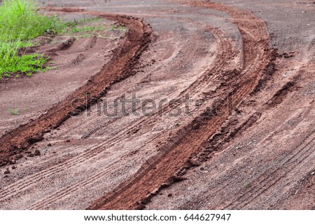 Tire tracks pattern prints on wet ground 