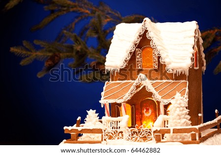 picture of gingerbread house over christmas background