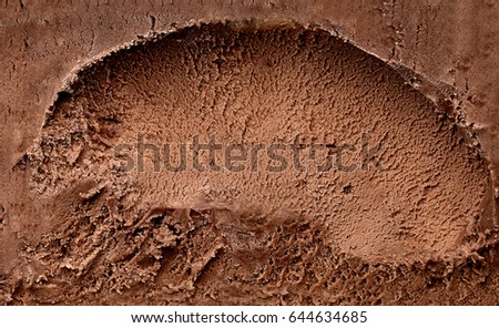 Scooped chocolate ice cream or chocolate ice cream from top or from above background