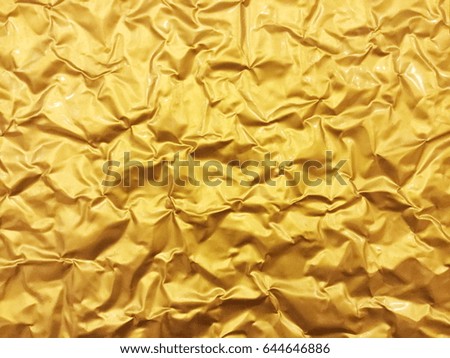 Texture of crumpled gold plate