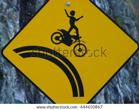 Unusual funny sign for a dangerous turn somewhere in the USA