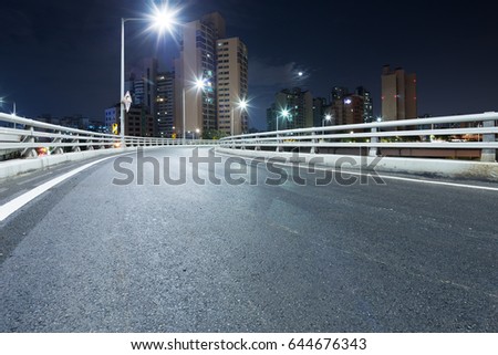 night scene of empty road in midtown of shanghai