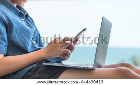 Digital lifestyle blog reader or school student using smart devices working on internet communication technology 
