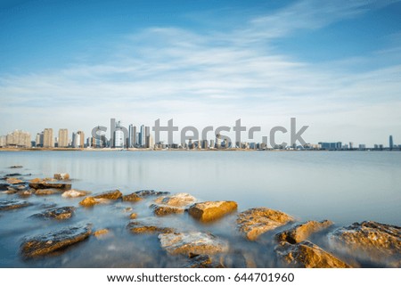 The riverside scenery of the city. Taken using Slow Shutter Speed. Long Exposure. Motion Blur and Soft Focus due to Long Exposure.