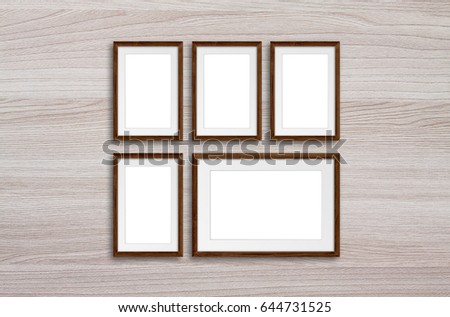 Five photo frames set on wooden panels wall, interior decor idea mock up
