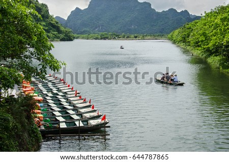 Boat with tourist travel around trang an Vietnam world heritage with moutain, rivel and sky.