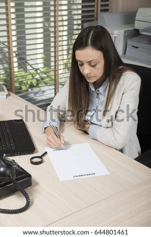 Sad business woman signs an empty contract