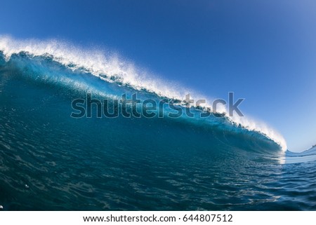 large blue wave crashing, close up, swimming