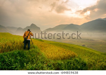 Vietnam Photographer take a photo landscape sunrise rice terrace on the mountain