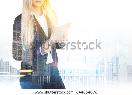 Portrait of an unrecognizable blond businesswoman with a notebook standing against a foggy city panorama. Mock up, toned image, double exposure