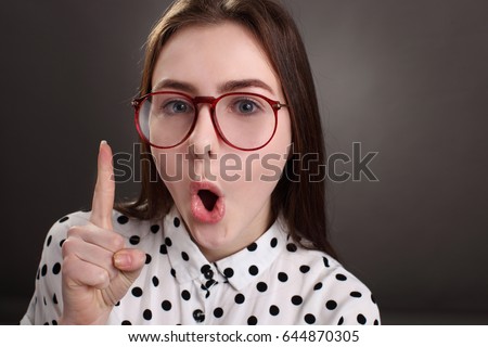 Crazy girl with glasses, portrait studio isolated shot