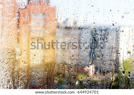 Rainy window Window with drops Window after rain Blurred buildings Sunny Sun after rain 