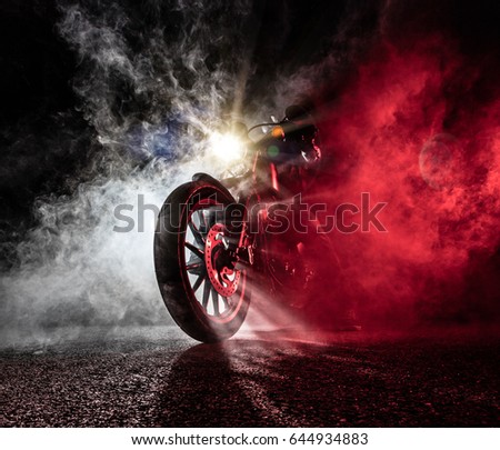 High power motorcycle chopper at night. Smoke on background. Royalty-Free Stock Photo #644934883