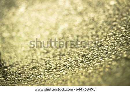 Water drops on glass background. Gold background.