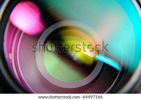 abstract closeup front of lens with pink and turquoise reflection Royalty-Free Stock Photo #64497166