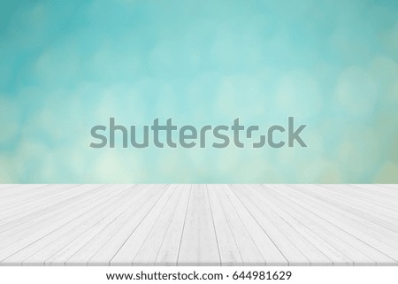 Empty white wooden table with blue blurred background,Free space for product editing