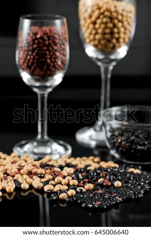 Dried grains collection on black background.