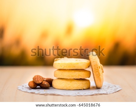 close up shot on cookie on wooden background and ripe wheat and straw detail on blur background, vegetable for diet with nutrition ingredient concept.