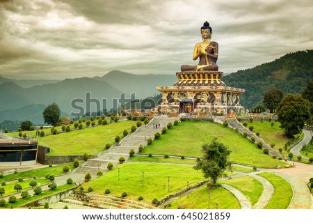 Beautiful huge statue of Lord Buddha, at Rabangla , Sikkim , India. Surrounded by Himalayan Mountains it is called Buddha Park - a popular tourist attraction. Royalty-Free Stock Photo #645021859
