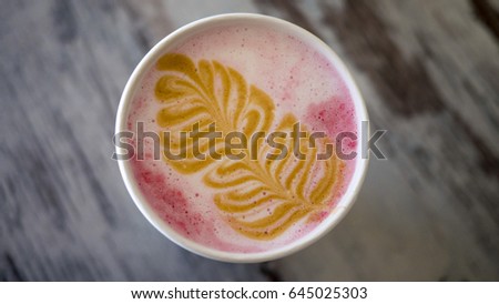 Picture of a Christmas tree on a latte coffee made of foam