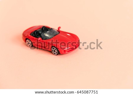 Retro toy car detail. Red toy car with an open top on a white background