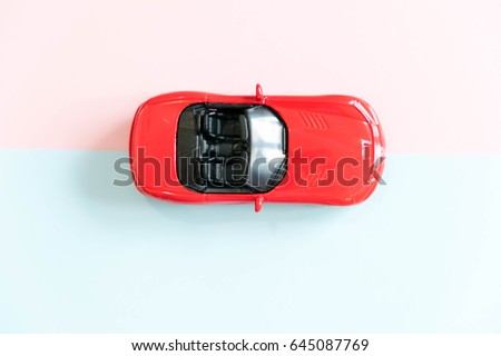 Retro toy car detail. Red toy car with an open top on a white background