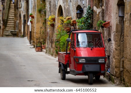 Piaggio Ape standing at the empty street of old italian town
 Royalty-Free Stock Photo #645100552