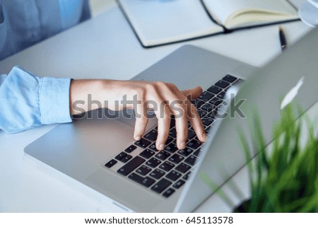 Woman typing text on laptop                               