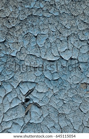 Old paint peeling from wall texture background