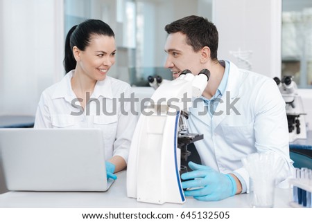 Positive delighted couple of analysts working together