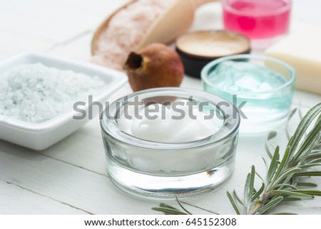 beauty product samples on white wooden table background