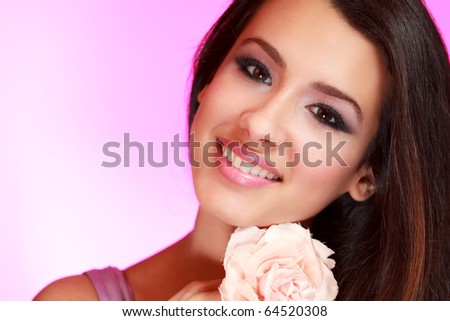 Beautiful multicultural young woman with a purple filtered background.