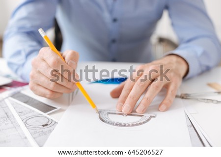 Professional engineer using a protractor