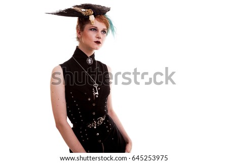 Woman in pirate costume over white background in studio photo. Carnival and halloween. Fantasy and masquerade