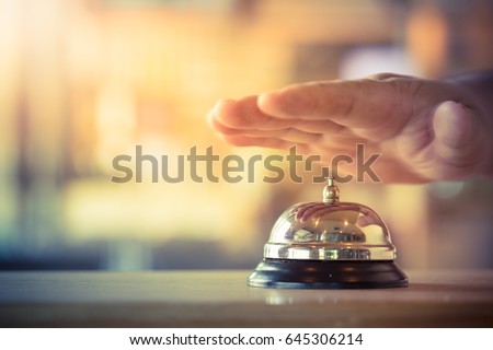 Restaurant bell vintage with hand. The bell of a psychologist Royalty-Free Stock Photo #645306214