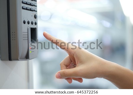 close up soft focus on woman hand scanning finger on machine concept. Royalty-Free Stock Photo #645372256