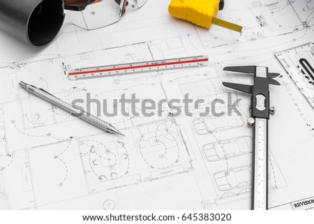 Construction plans  and drawing tools on blueprints
