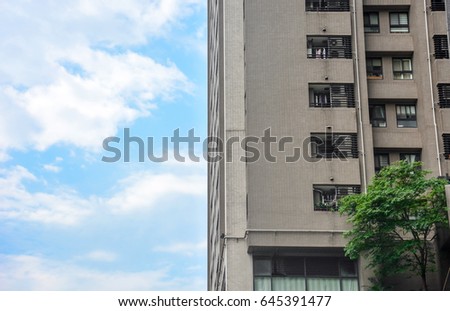 old vintage brownstone apartment building corner with blue sky background, Taipei, Taiwan 