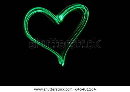 Light Painting Photography Heart Symbol against a black background