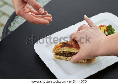 Burge cut into two pieces in the hands of women