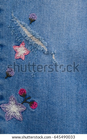 denim embroidered flowers leg jeans texture.