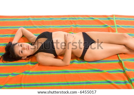 Teenager Latina female taking sunbath (isolated)