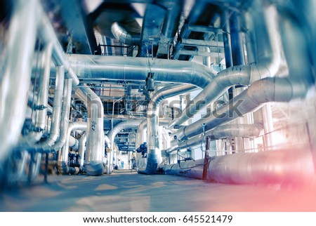 Industrial Factory. Various mechanisms and metal pipes. Toned image. Motion blur effect.