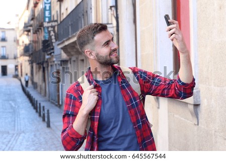 Man snapping a selfie for social media