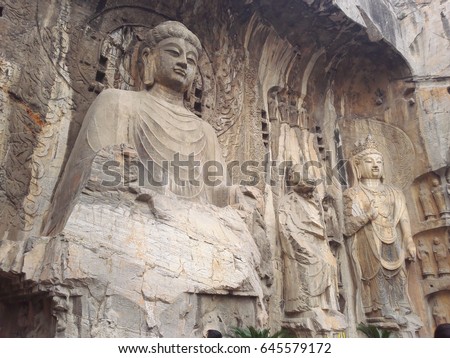 Dragon's Grottoes Gate is alternative name of Longmen Caves located at Luoyang Henan China, which is artificial caves excavated from the limestone cliffs of the Xiangshan and Longmenshan mountain.