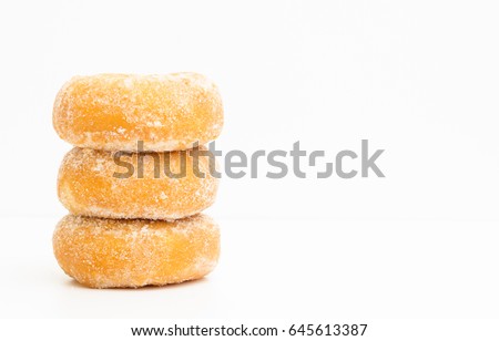 mini donuts sugar,sweet pieces of sugar doughnuts on white background, Copy space Royalty-Free Stock Photo #645613387