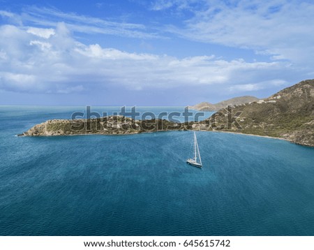 A single speedboat floating on the Caribbean sea, blue water, blue sky, Antigua